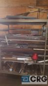 Lot of assorted steel and metal stock contents of the stock rack, stock rack is included.
