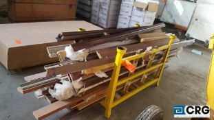 Lot of assorted wood molding, and flooring, metal stand not included, Metal Crate extra $50.00