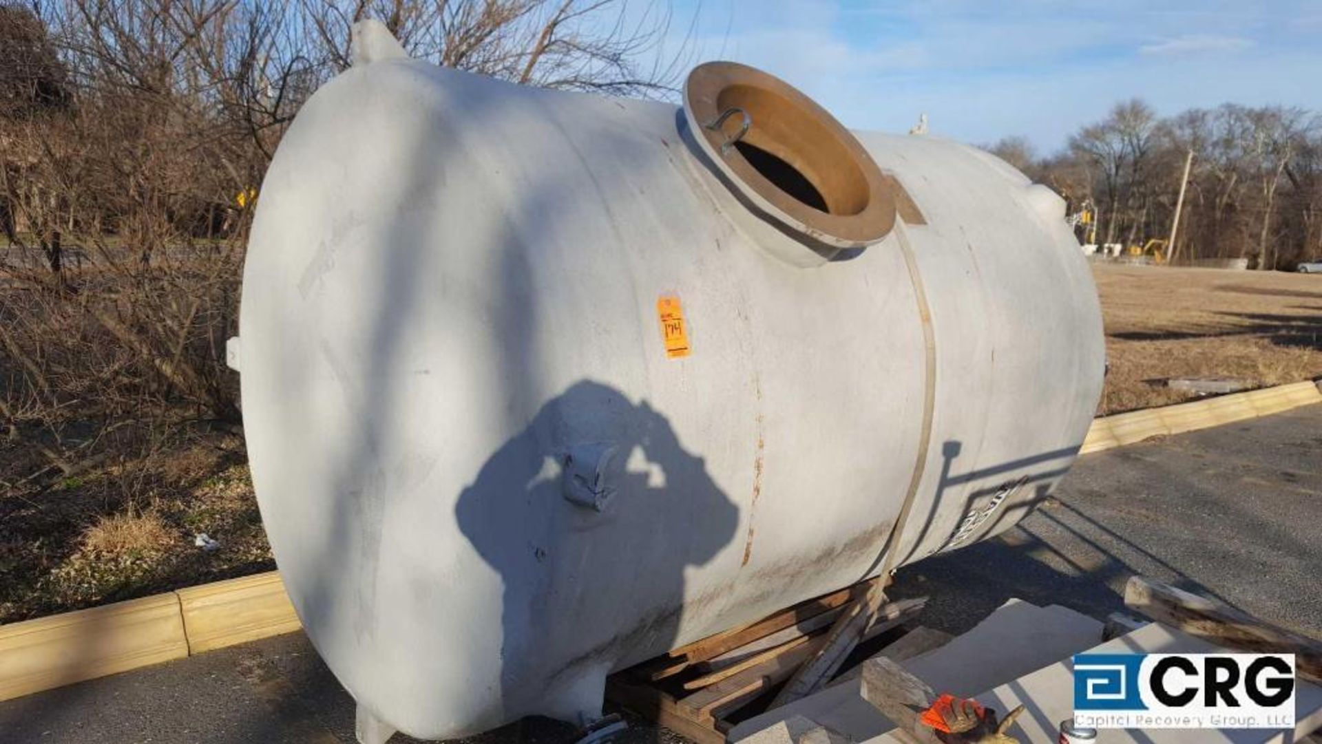 6 foot diameter x nine foot long poly tank with manhole access, Stone Quest Will load for $50.00