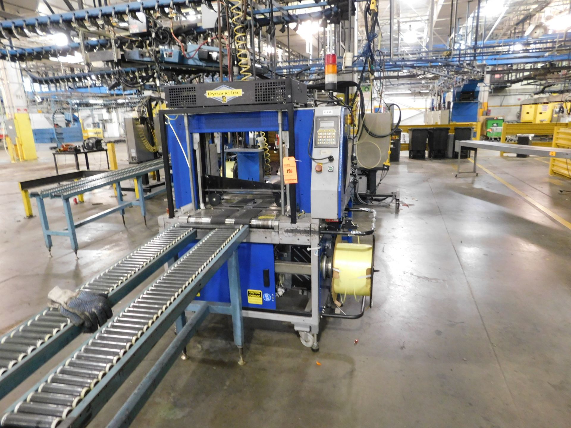 2002 Dynark banding machine with discharge roller conveyor, 10 ft. long by 18 in. wide, asset # T18,