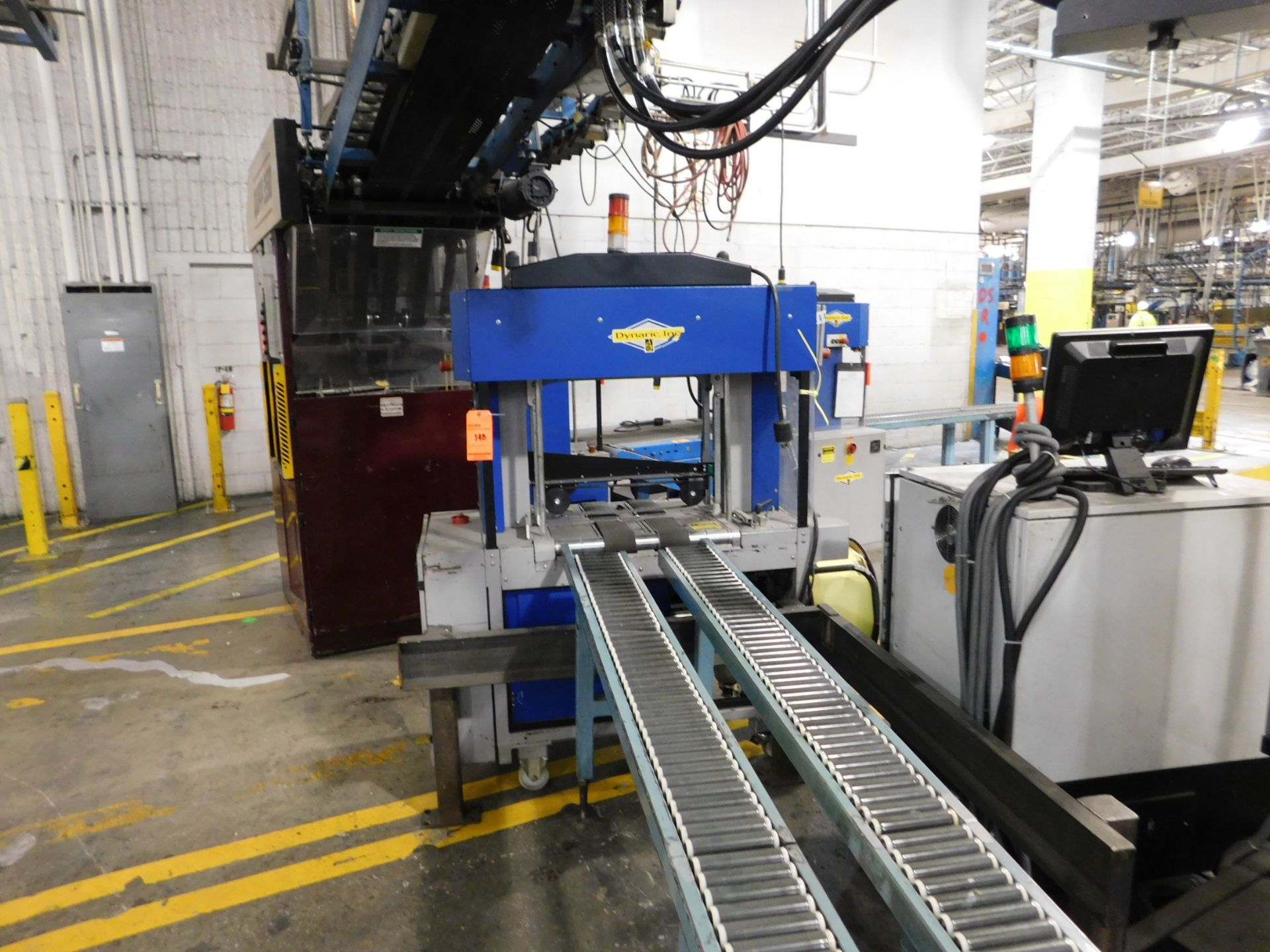 Dynark banding machine with discharge roller conveyor, 10 ft. long by 18 in. wide, asset # PT8009