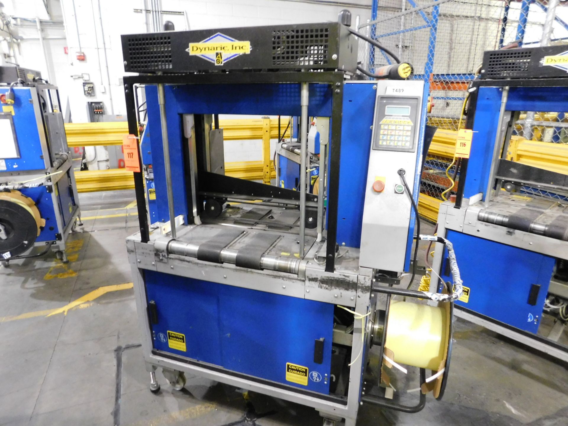 Dynark banding machine with discharge roller conveyor, 5 ft. long by 18 in. wide, mobile, asset #