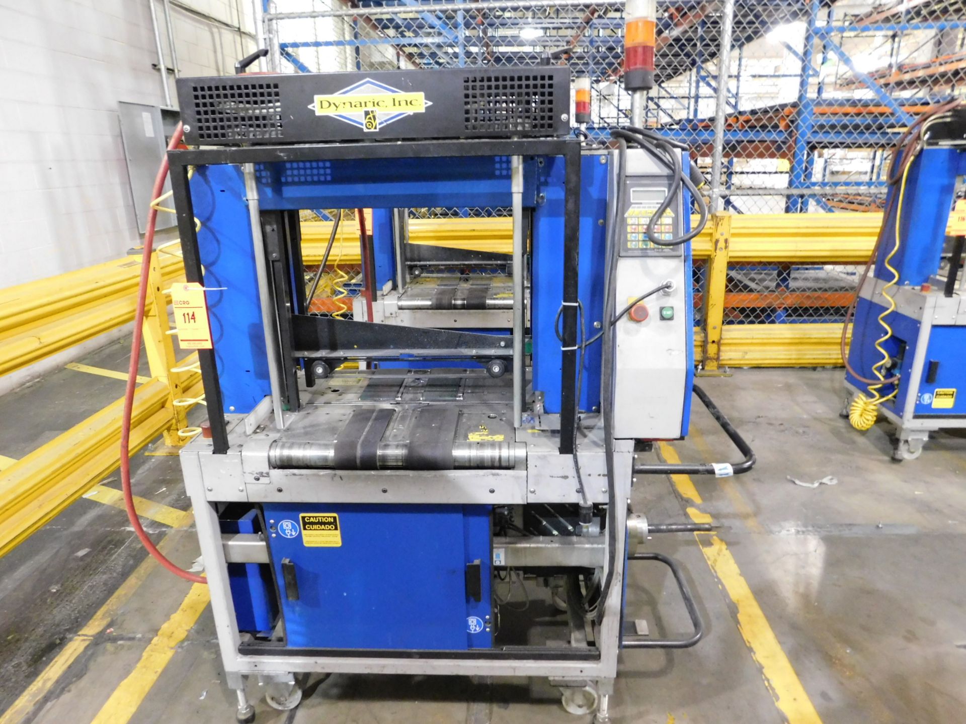 2000 Dynark banding machine with discharge roller conveyor, 5 ft. long by 18 in. wide, mobile, asset