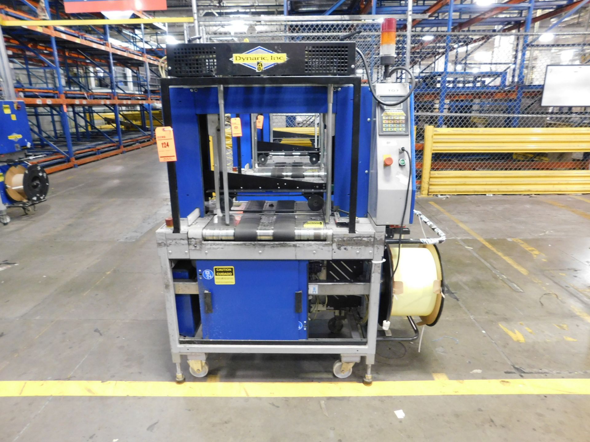 2002 Dynark banding machine with discharge roller conveyor, 5 ft. long by 18 in. wide, asset #