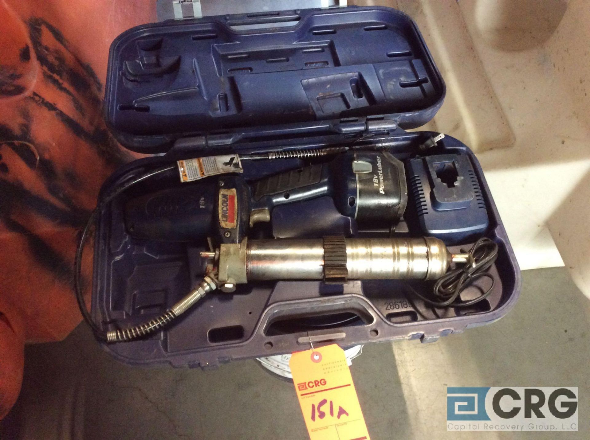 Lincoln 18 volt cordless lube gun with charger and case (LOCATED INDUSTRIAL COURT INSIDE)