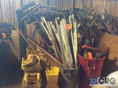 Lot of asst brooms, mops, and mop buckets