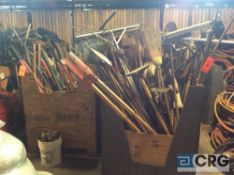 Lot of asst landscaping and gardening tools including post hole digger, rakes, brooms, shovels,