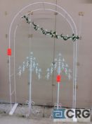 Lot includes (1) white metal archway and (2) white metal candelabras.