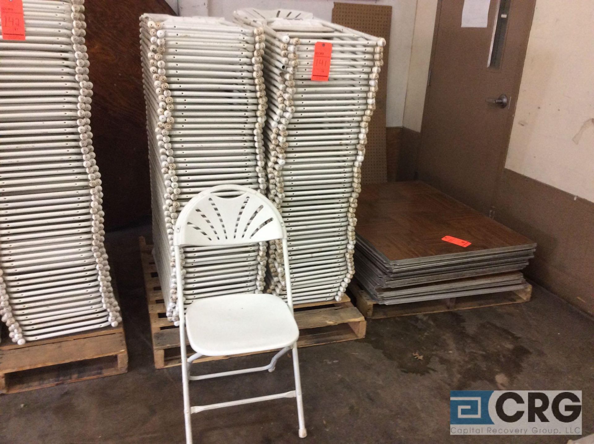 Lot of (100) assorted white, fan back, plastic seat with metal frame, folding chairs.