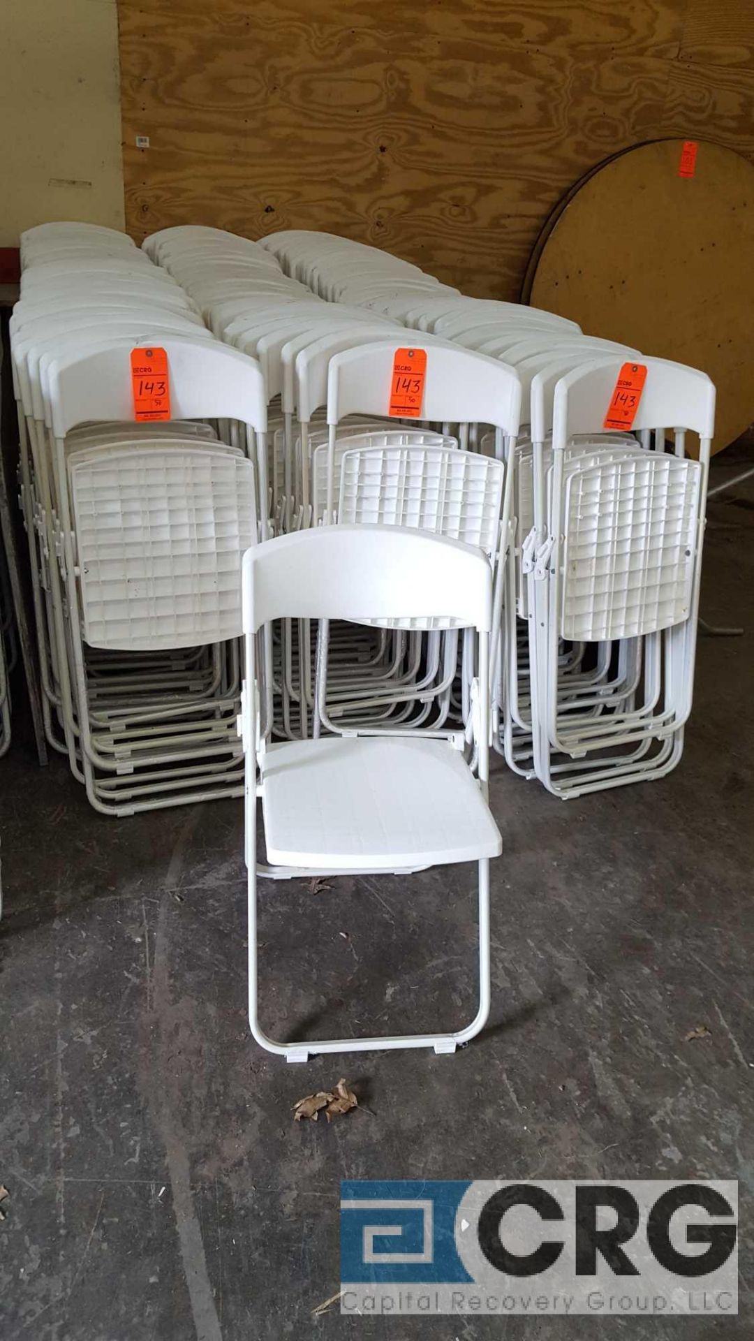 Lot of (150) white plastic seat, metal framed folding chairs.