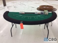 Blackjack table with card shoe and chips.