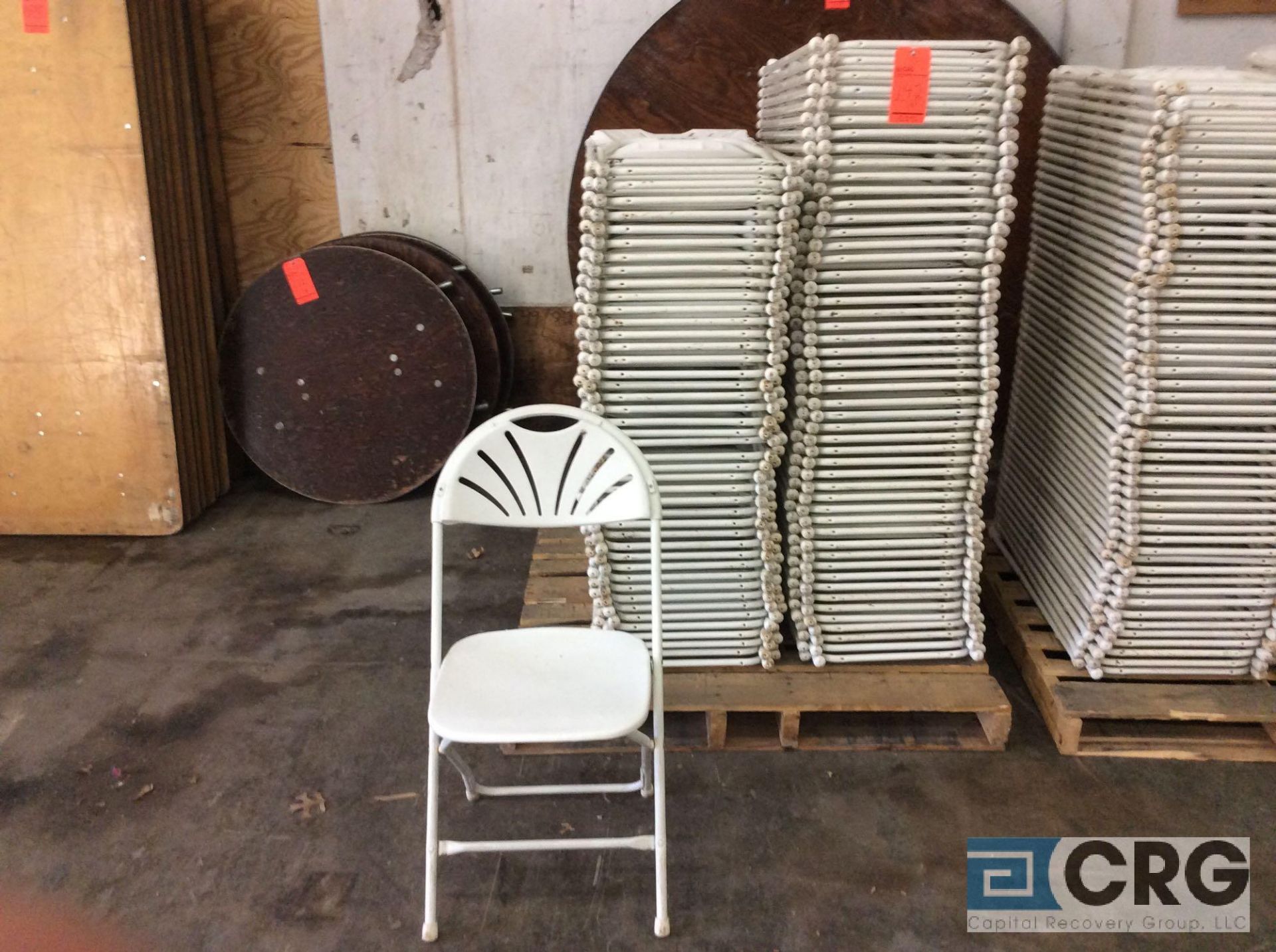 Lot of (93) assorted white fan back, plastic seat with metal frame, folding chairs.