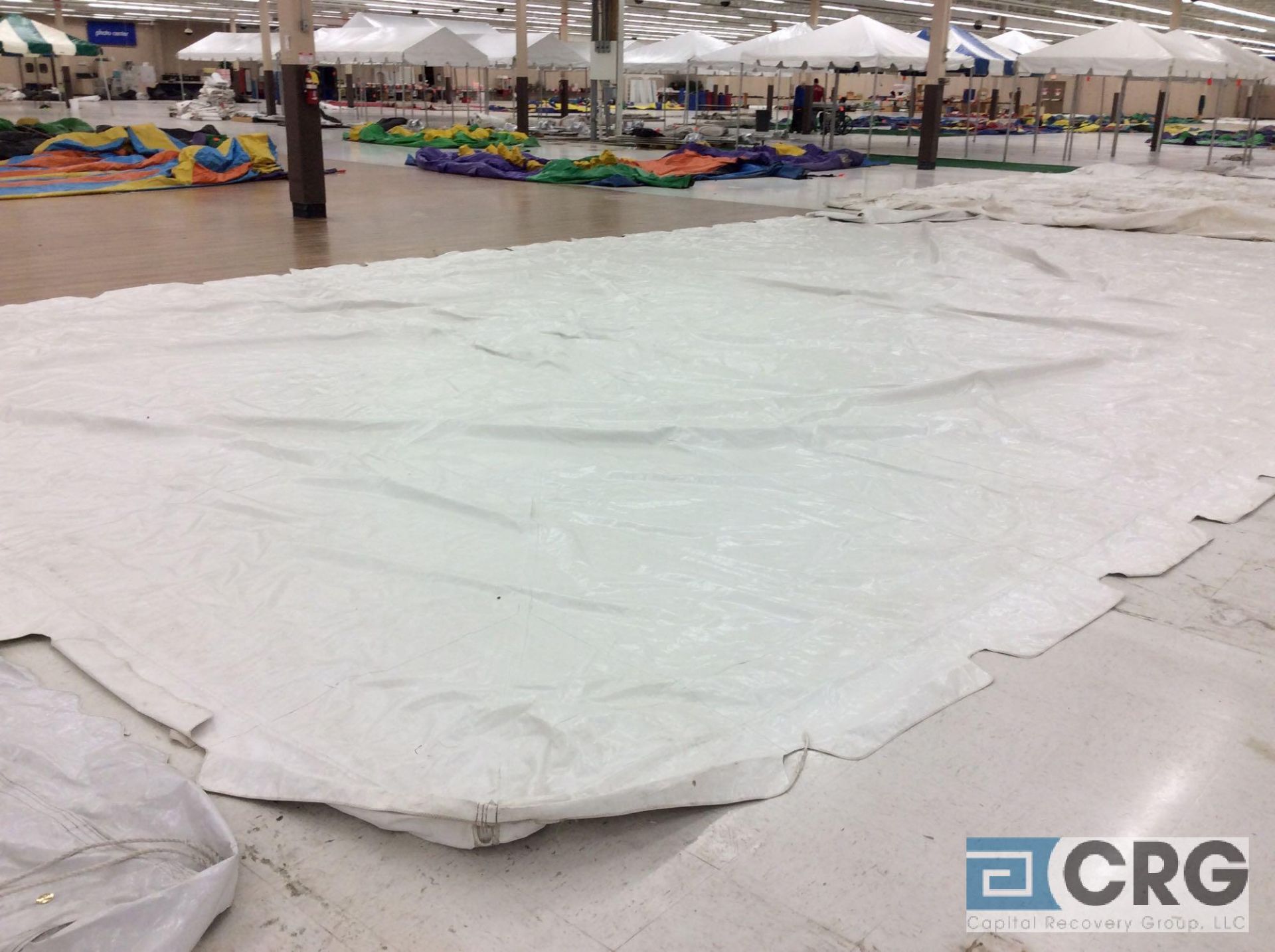 Anchor 20' x 40' white tent top, top only. Buyer is responsible to fold for removal. Some corners