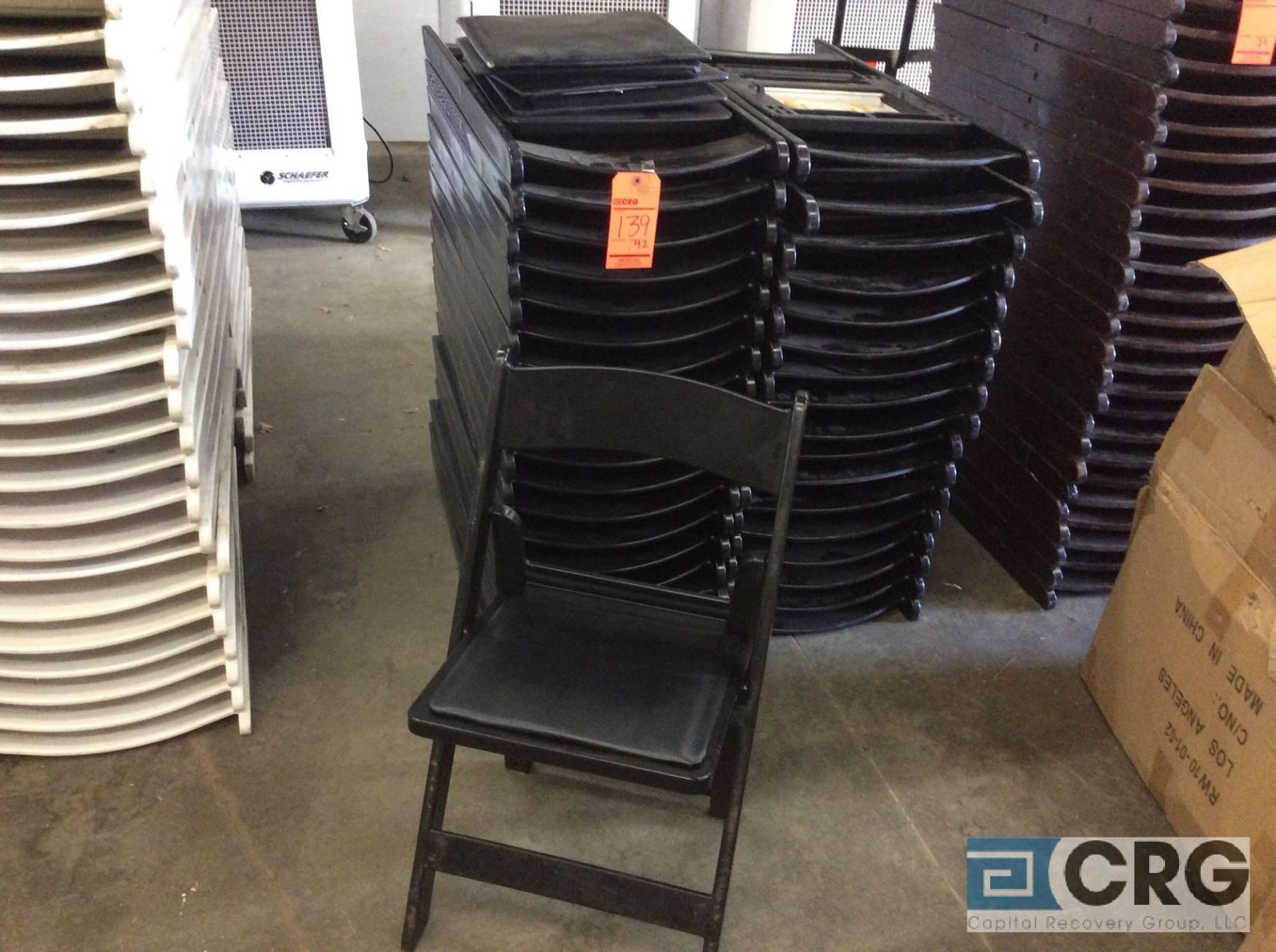 Lot of (40) assorted black resin folding chairs.