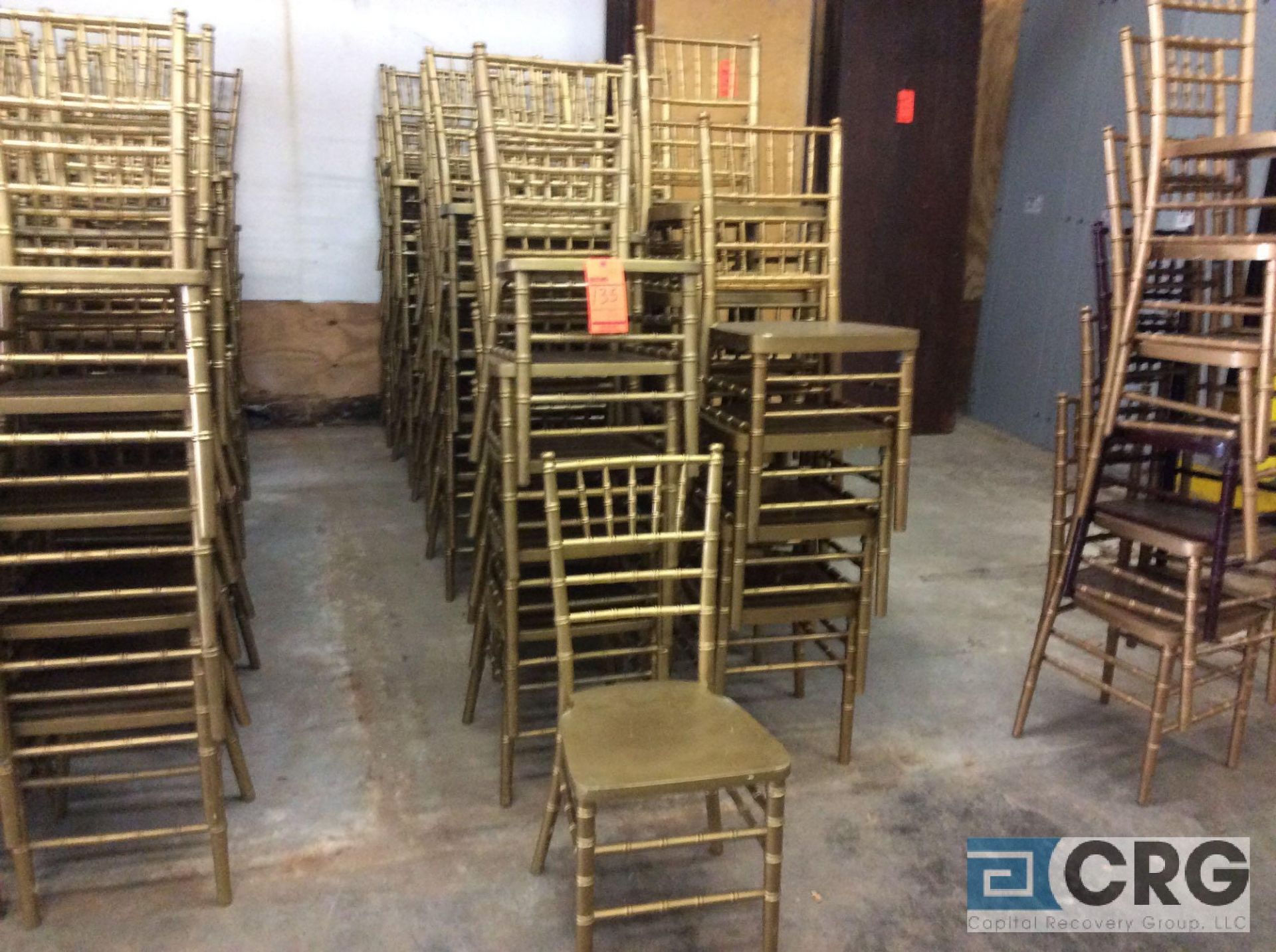 Lot of (59) gold chivari chairs.