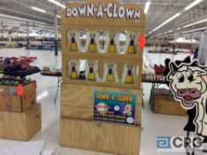 Down a clown carnival game with 2 wood cases.