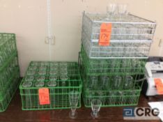 Lot of (104) assorted glasses, with (6) assorted racks, includes (20) pilsner glasses and (84)