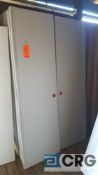 Lot of (21) solid doors all 24 in. wide with door knob cut out