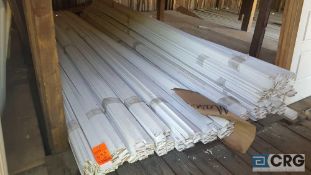 Lot of approximately (335) 12 ft. long white strips of molding