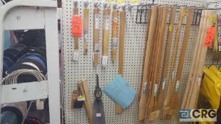 Lot of assorted axe handles, wedges, and pick head etc.