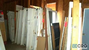 Lot of assorted doors and windows, etc. including approximately (45) doors, (4) windows, and (7)