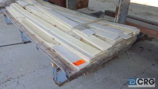 Lot of (155) 5 1/4 in. x 5/16 in. x 12 ft. masonite siding panels with assorted shorts