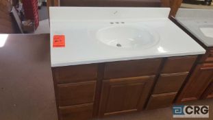 Wood vanity with porcelain top, 21 1/2 in x 42 1/2 in, with (6) drawers and (1) door NEW