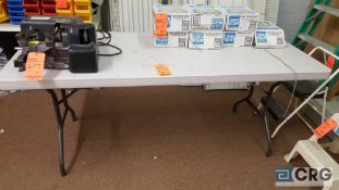 Lot includes (1) 6 ft. plastic top folding table, (1) 8 ft. wood table, and (1) 4 ft. by 4 tier