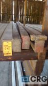 Lot of (4) 3 1/2 in. by 5 1/4 in. by 12 ft. long wood beams