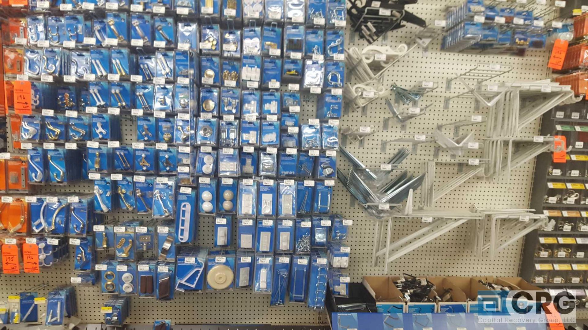 Lot of assorted hooks, door stops, hasps, peg board hooks, handles, shelf brackets etc.