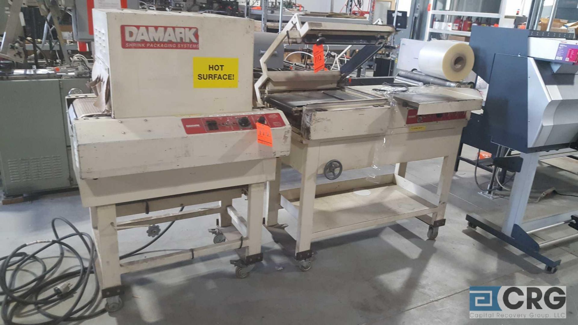 Damark model SMC 1620, s/n 4978, L- bar sealer with shrink tunnel.