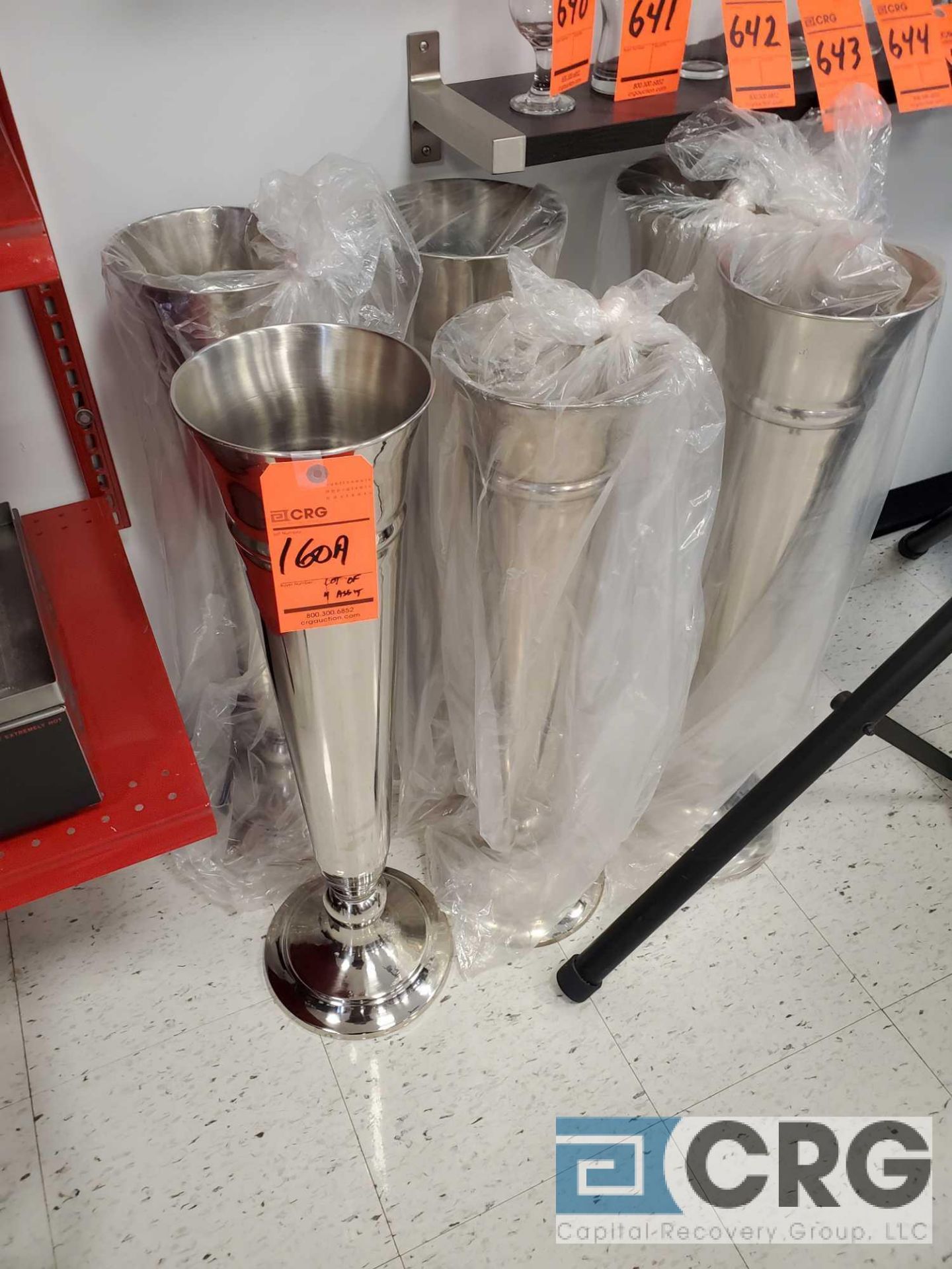 Lot of (4) stainless steel floor type vases