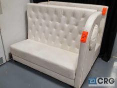 While upholstered high back love seat