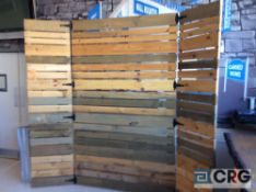 Lot includes (1) hinged, wood slat backdrop, and five assorted stained and sanded wood pallets.