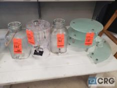 Lot of glass drink dispensers and serving station