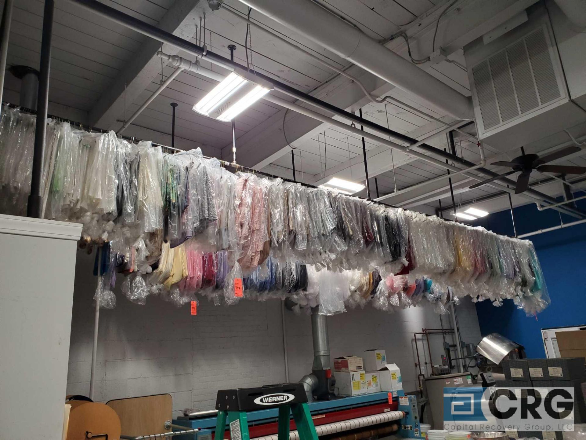 Lot of approx (3800) asst sashes, overlays, and runners (hanging from ceiling style rack)