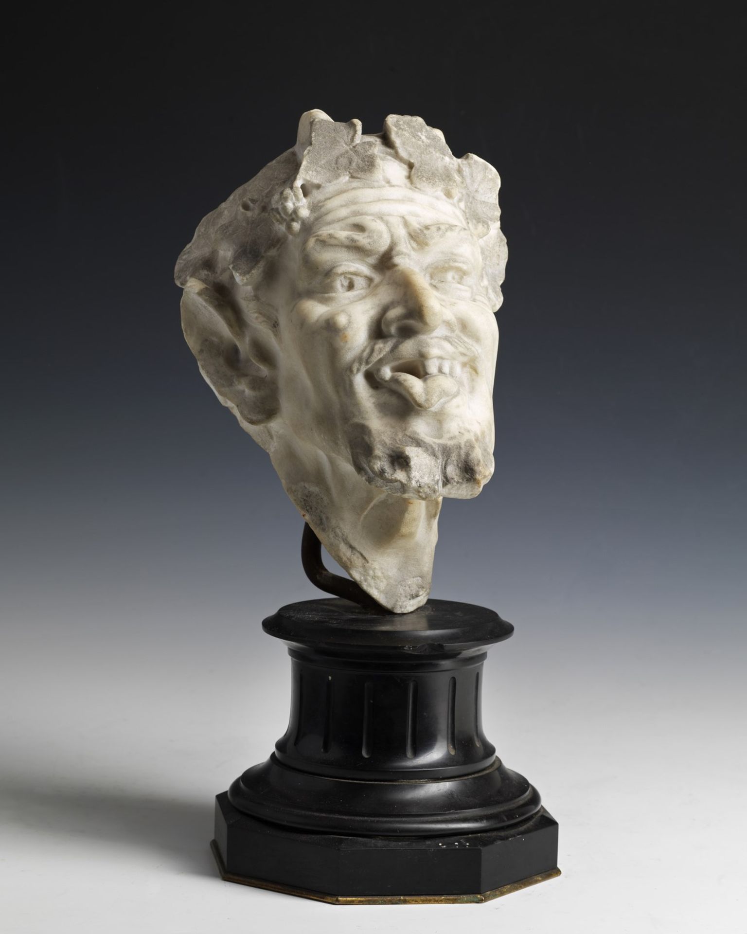 ARTISTA DEL XVIII SECOLO Head of faun in carved marble.