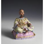 MANIFATTURA DI MEISSEN DEL XVIII SECOLO Magot figure in porcelain painted, hands and feet tilting.