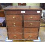 A table top miniature chest, of eight long drawers, 40 cm wide