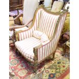 A 19th century Continental carved wood wing back armchair, with stripey floral upholstery, on turned
