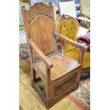 A 19th century Continental armchair, with a carved back