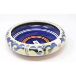 A Bursley Ware lustre bowl, cracked, 25.5 cm diameter, a Royal Doulton toothbrush holder,
