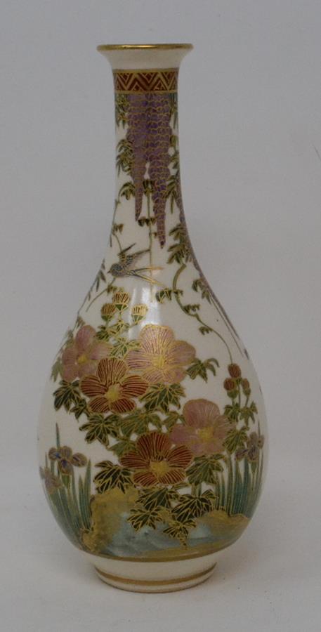 A Japanese Satsuma vase, decorated birds, flowers and foliage, 18 cm high, and another, decorated