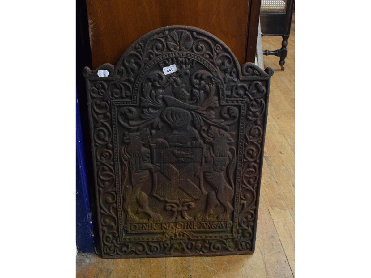 A Victorian cast iron fireback, having a coat of arms within a foliate border, 53 cm wide