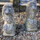 A pair of reconstituted stone lions, 62.5 cm high (2)
