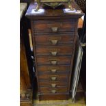 An early 20th century oak filing cabinet, with eight drawers, 42 cm wide