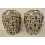 A pair of pottery vases, with geometric decoration, 40 cm high (2)