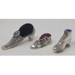 A novelty silver pincushion in the form of a rollerskate, 3 cm high, similar boot, and a similar