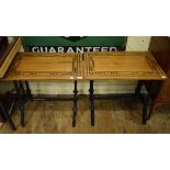 A pair of Anglo-Indian tables, the rectangular satinwood tops on ebonised legs, 67 cm wide (2)