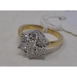 A 9ct gold and seven stone diamond flowerhead ring, approx. ring size N Modern